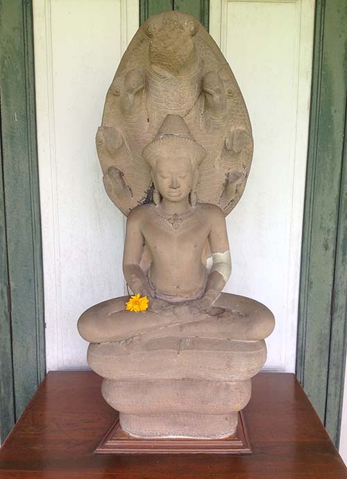 A sandstone image of the meditating Buddha