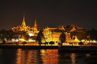 View of the illuminated Grand Palace from the ship