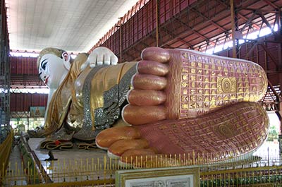 The enormous reclining Buddha image at the Chauck Htat Gyi pagoda, its soles showing the 108 auspicious characteristics of the Buddha