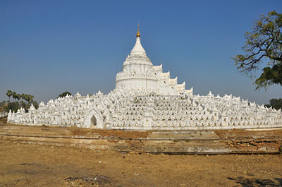 The all white Hsinbyume pagoda representing the center of the universe in Buddhist cosmology
