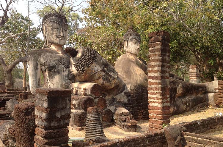 Three large Ayutthaya era images of the Buddha in the remains of the viharn of the Wat Phra Kaew in Kamphaeng Phet Historical Park