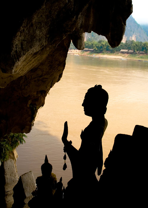 Buddha image in the Pak Ou caves overlooking the Mekong river