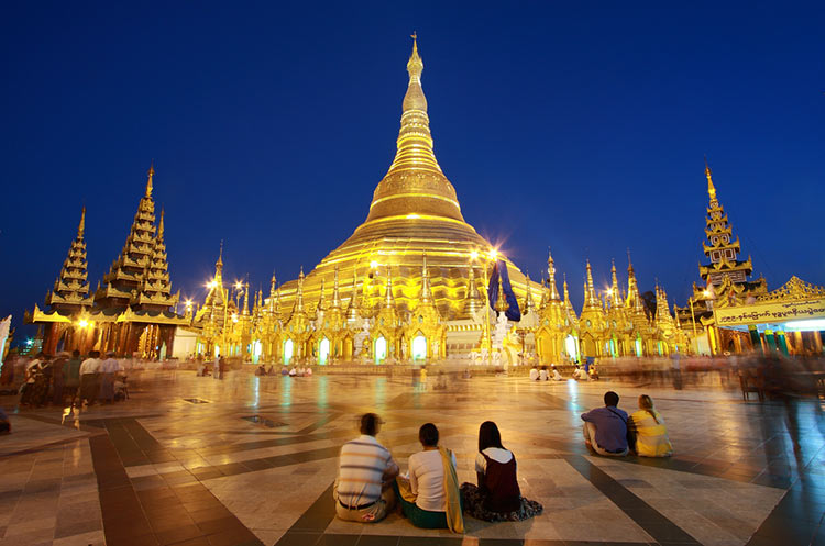 The gold plated main stupa of the Shwedagon pagoda at dusk
