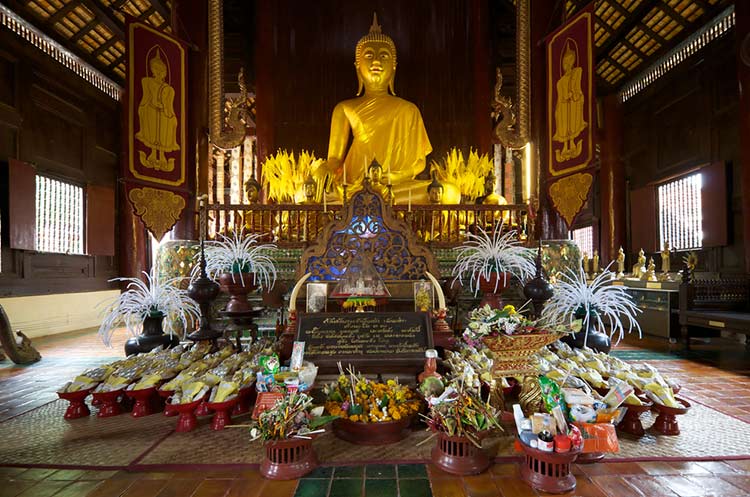 Interior of the wooden viharn of the Wat Phan Tao in Chiang Mai