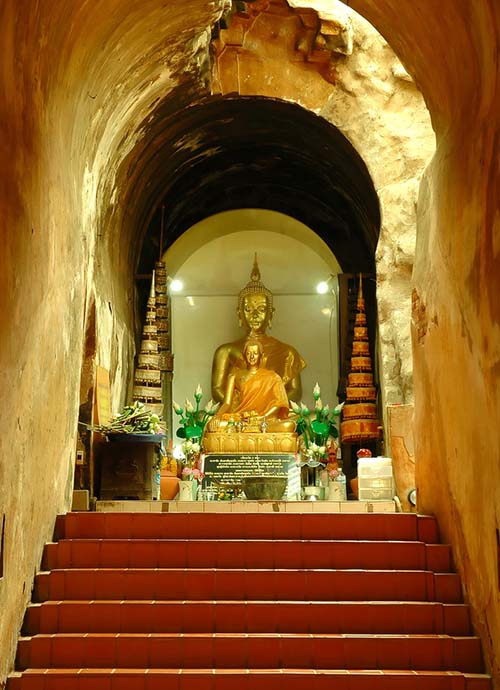 Buddha image in a shrine in one of the tunnels of the Wat Umong