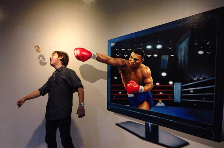 Getting knocked out by a boxer emerging from a TV at 3D Trickeye Museum Phuket