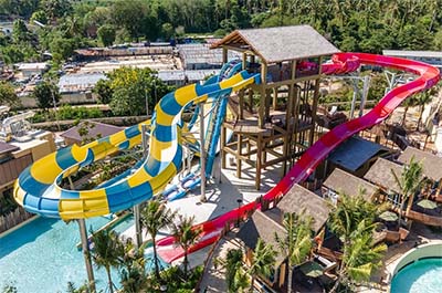 Two waterslides ending in a pool at Andamanda Water Park