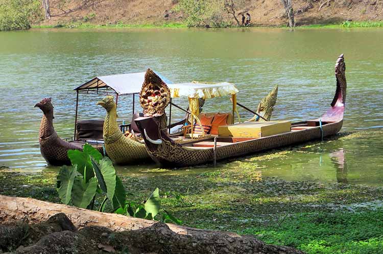 A couple of baray boats laying in the water at the Angkor Archaeological Park