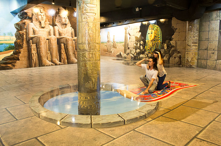 People on a flying carpet in an ancient Egyptian temple