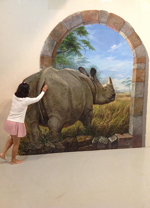 Pushing back a rhino into the painting