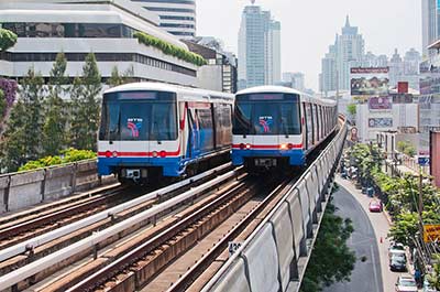 Two trains of the BTS Skytrain in downtown Bangkok