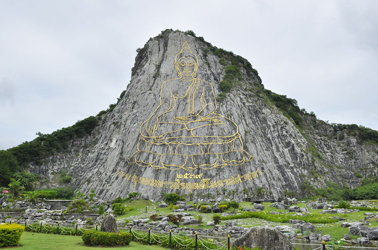 Huge golden Buddha image carved out of the rock on Buddha Mountain Pattaya