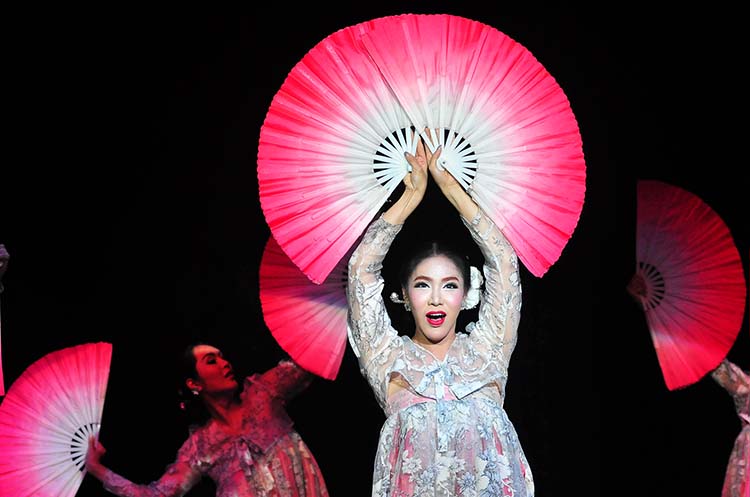 Performers wearing colorful traditional Korean dress during the performance of the Korean folk song Arirang