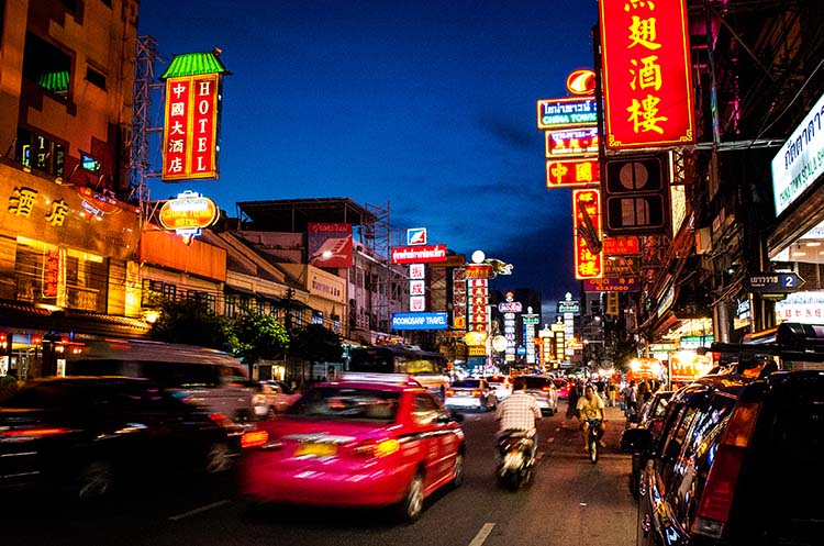 A busy street in Bangkok Chinatown in the evening