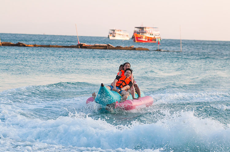 People on a fun banana boat ride