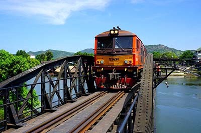 A train on the Death Railway crossing the River Kwai