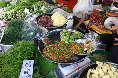 Vegetables, fruits and chilies for sale at a local market