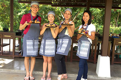 Studentes showing off the food they have prepared