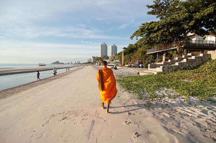 A monk walking the beach in Hua Hin