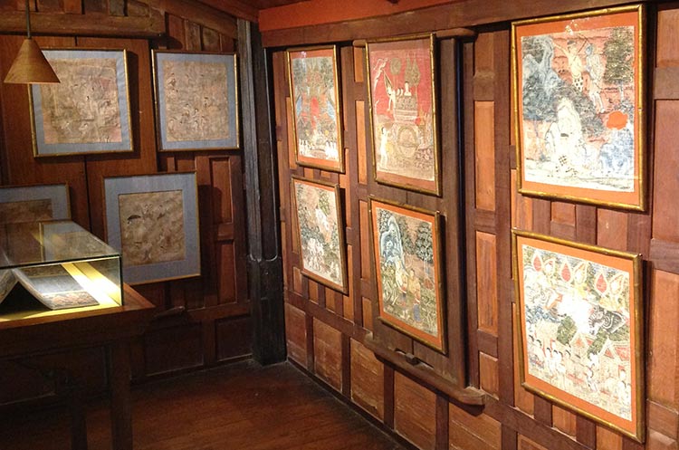Old paintings depicting Buddhist stories at Jim Thompson House