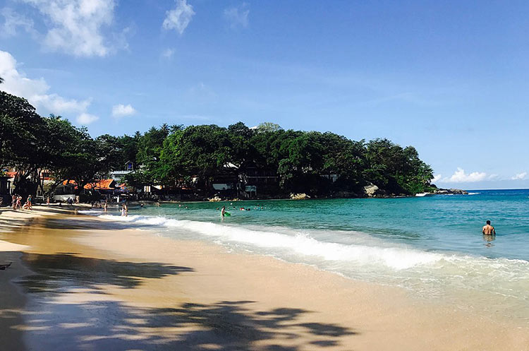 People swimming in the sea at Kata, Phuket