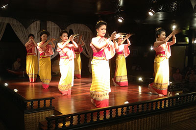 Young women performing the traditional fingernail dance at the Old Chiang Mai Cultural Center