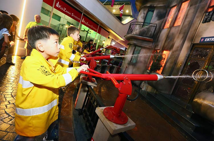 Children playing fireman at Kidzania Bangkok