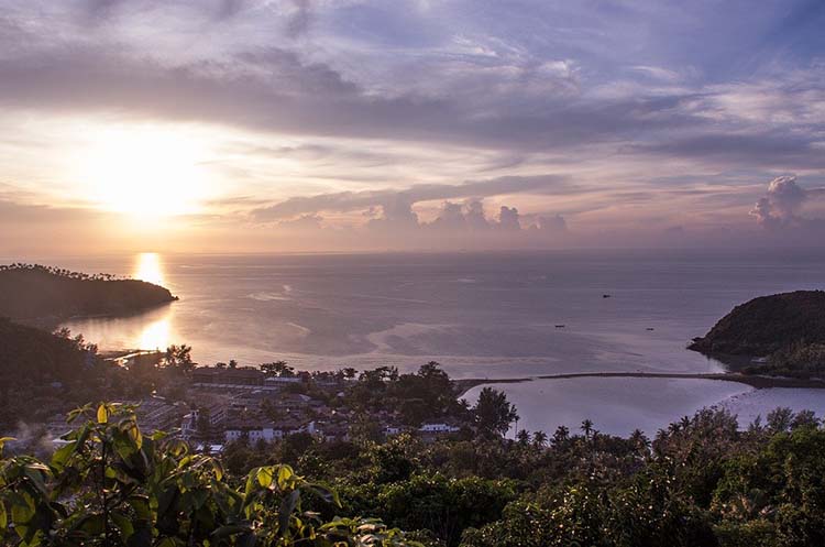 A bay at sunset on Koh Phangan viewed from the island’s hilly interior