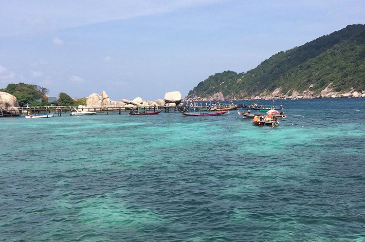 Boats floating in a bay at Koh Tao