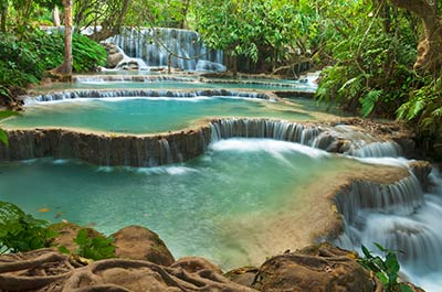 Kuang Si waterfall and a number of turquoise pools in the tropical forest