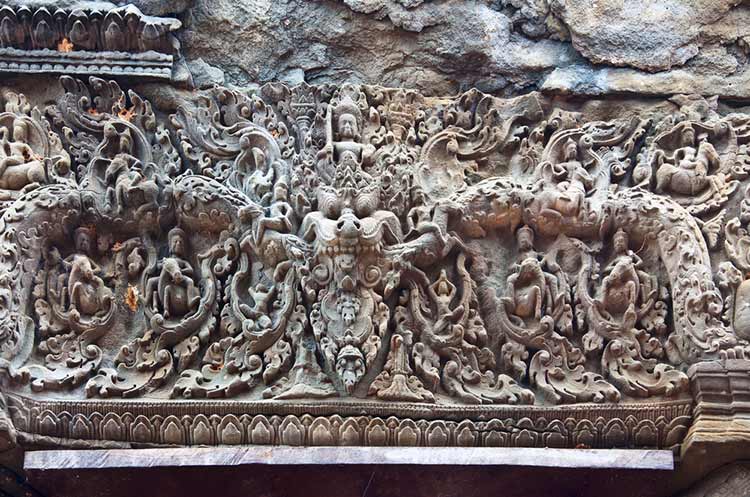 Lintel with sculptings of a Kala at the Lolei temple in Angkor