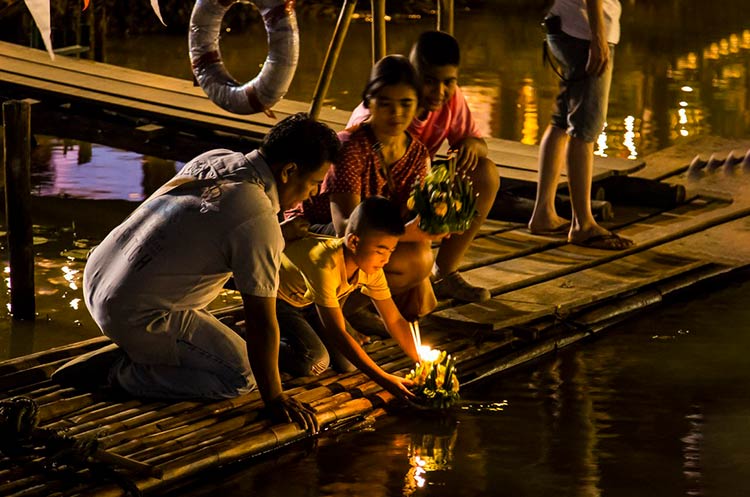 Thai people floating a krathong during Loy Krathong festival in Chiang Mai
