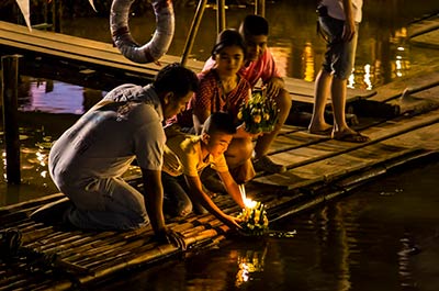 Thai people celebrating Loy Krathong