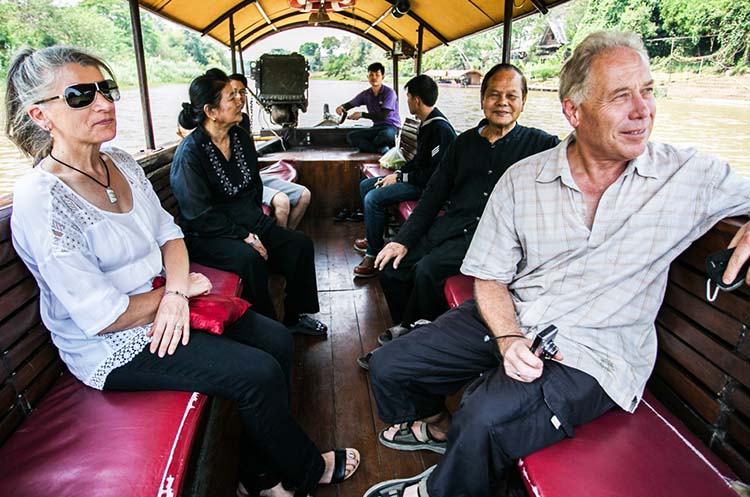 People watching the scenery on the Mae Ping River cruise