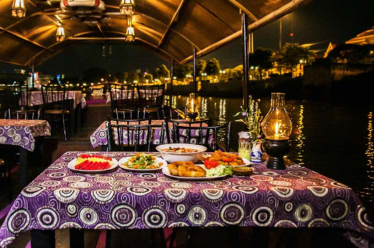 Dinner table aboard the Mae Ping dinner cruise boat