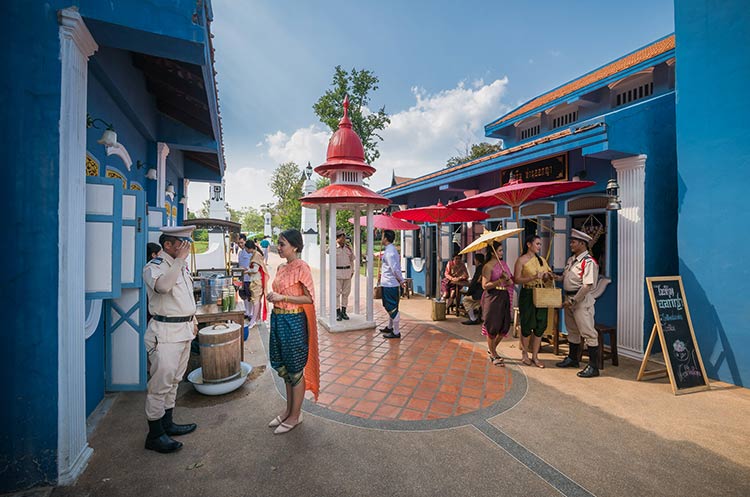 A street in Mallika City with people wearing traditional clothing