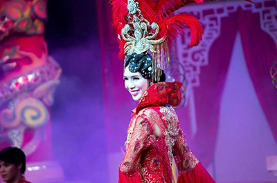 An elegant dancer on stage at the Miracle Cabaret Show in Chiang Mai
