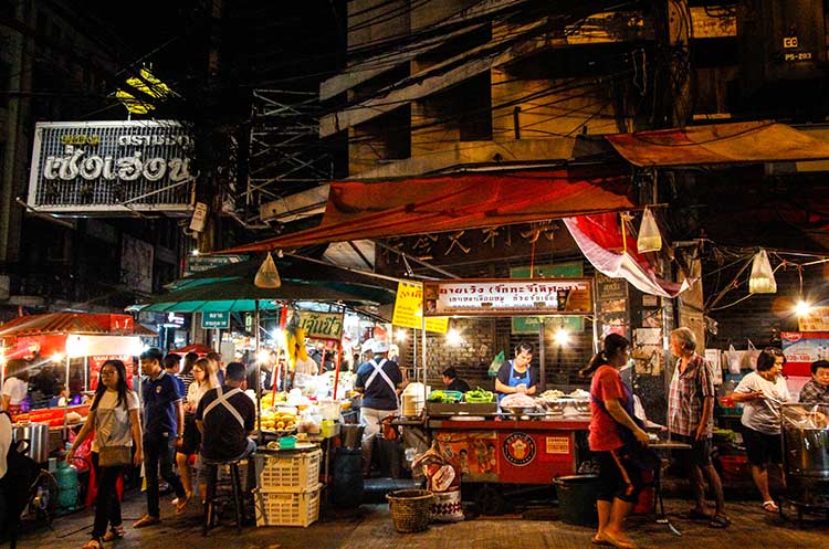 People at food stalls at Thepprasit road night market in Pattaya