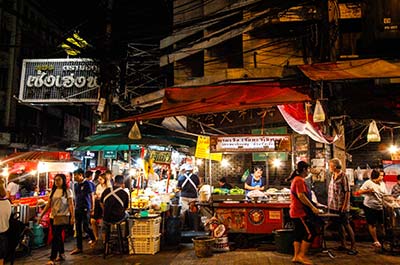 People walking around the Thepprasit road night market in Pattaya