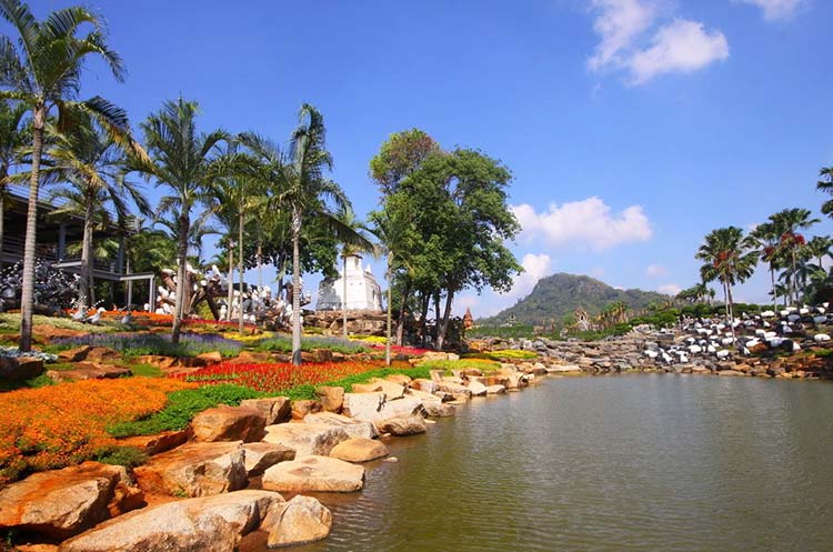 Lake, trees and colorful flowers at Nong Nooch