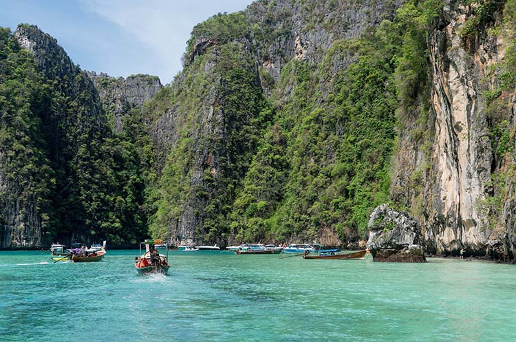 Pi Leh Lagoon surrounded by steep limestone cliffs