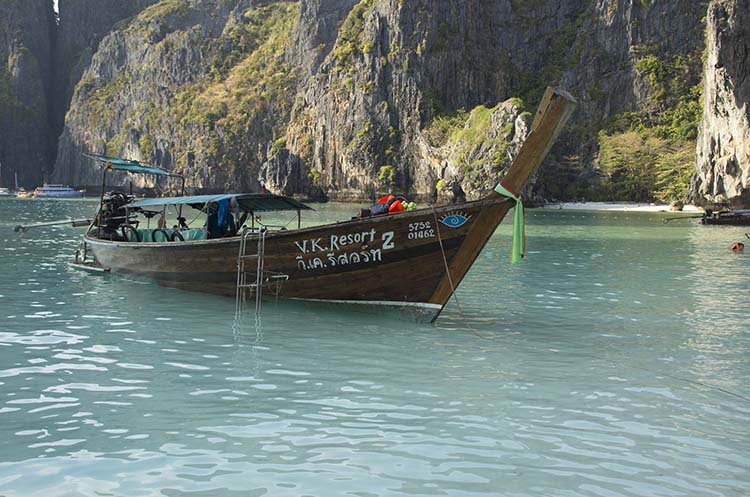 A longtail boat taking people snorkeling at the Phi Phi Islands