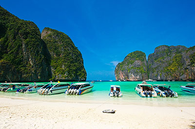 Speedboats on the beach of Maya Bay, Phi Phi Islands