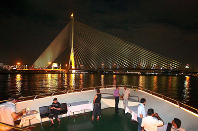 The ship at the illuminated Rama VIII bridge