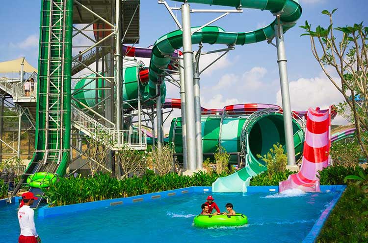 A water ride and children in a pool