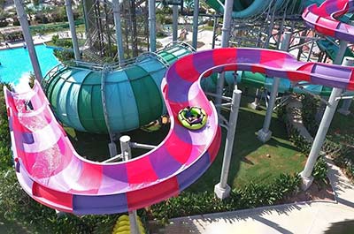 A long water slide ending in the pool at Ramayana Water Park