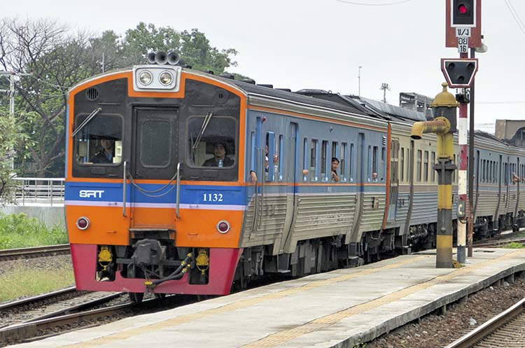 A regional train at a train station in Thailand