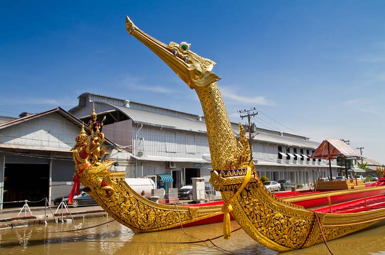 Two ornately decorated barges at the Royal Barges Museum