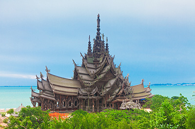 The Sanctuary of Truth in Pattaya with the sea in the background