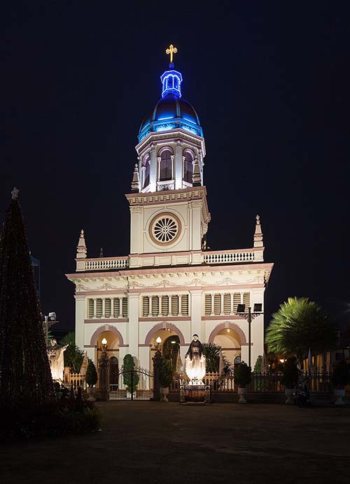 The illuminated Santa Cruz Church at night standing on the West bank of the Chao Phraya river in Bangkok